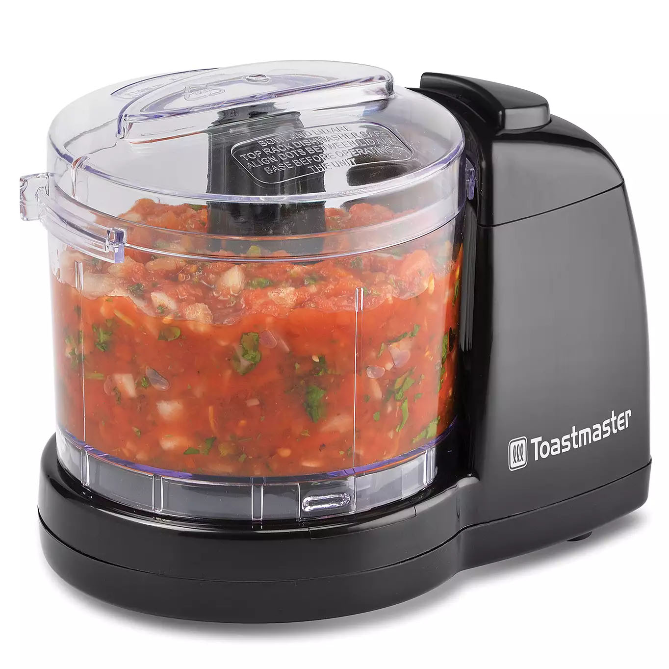 A small black electric food chopper with a transparent bowl filled with chopped vegetables, branded by Toastmaster.