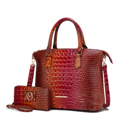 A textured, crocodile-pattern handbag in shades of red and brown with a matching wristlet wallet.