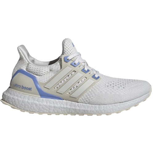 A white Adidas Ultraboost running shoe featuring a blue heel accent and cream-colored stripes on the sides.