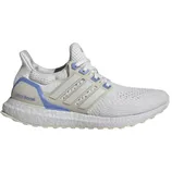 A white Adidas Ultraboost running shoe featuring a blue heel accent and cream-colored stripes on the sides.