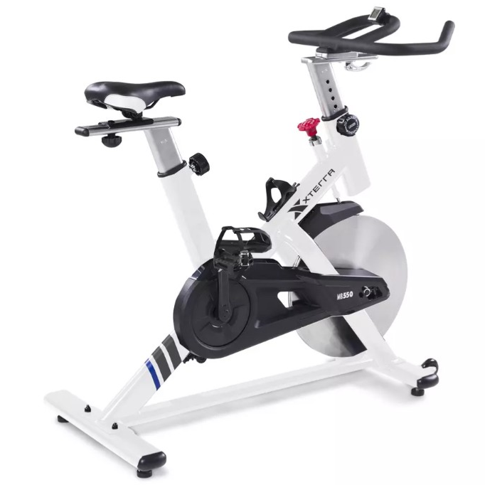 Xterra MB550 indoor cycling bike featuring adjustable seat and handlebars, flywheel, and pedals with straps for home exercise.