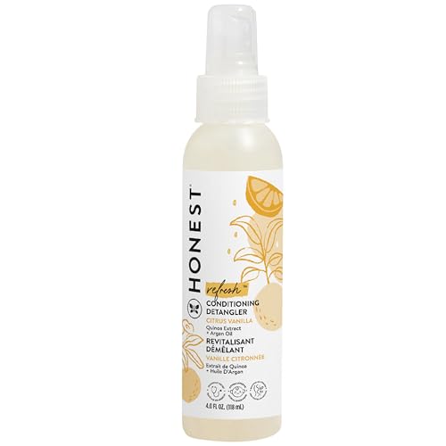 A bottle of Honest Conditioning Detangler with a spray nozzle, featuring a citrus vanilla scent, in a 4 fl oz size. The label displays yellow citrus fruit illustrations.