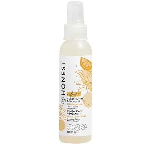 A bottle of Honest Conditioning Detangler with a spray nozzle, featuring a citrus vanilla scent, in a 4 fl oz size. The label displays yellow citrus fruit illustrations.