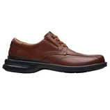 A brown leather casual shoe with a black sole featuring lace-up closure and stitched detailing.