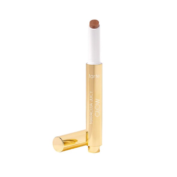 Tarte Maracuja Juicy Glow highlighting stick in a sleek gold tube with a brown highlighter tip and the cap beside it.