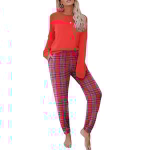 Red long-sleeve top paired with red and blue plaid pants. Barefoot pose.