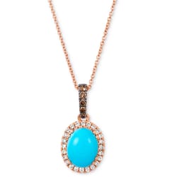 A gold necklace with a turquoise oval pendant, encircled by small diamonds and a bail studded with brown stones.