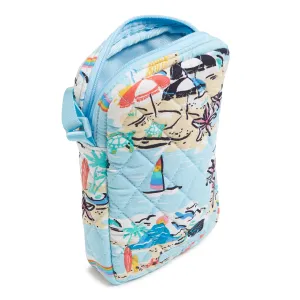 Quilted fabric pouch with a colorful beach-themed print and a light blue handle.