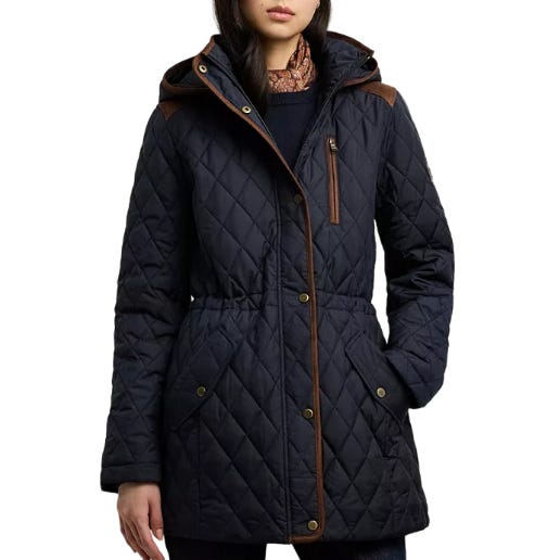 A navy blue quilted coat with a hood, featuring brown trim around the hood and zipper line, snap-button closure, and a belted waist.