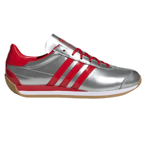 Athletic shoe with a silver body, red accents, and three red stripes on the side. It features a gum-colored sole and red laces.
