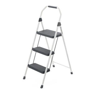 This is a three-step steel stool with a white frame, black steps featuring a non-slip texture, and a top handle for grip and balance.