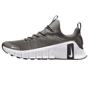 Green and white Nike Free Metcon 6 training shoes with a flexible sole design and a large black Nike swoosh on the side.
