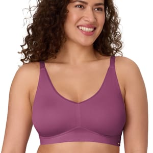 A woman wearing a purple wireless bra with thin straps and a smooth finish, providing a comfortable fit.