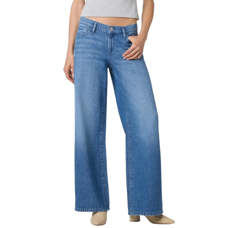 Wide-leg blue jeans paired with a cropped gray top, worn with beige heeled boots.