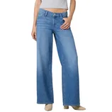 Wide-leg blue jeans paired with a cropped gray top, worn with beige heeled boots.