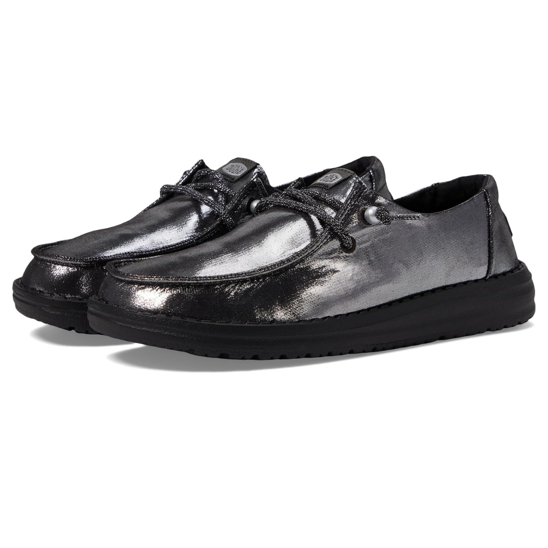 A pair of glossy black lace-up casual shoes with thick soles.