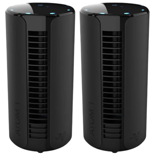 Two black cylindrical air purifiers with vent slits and touch controls on top.