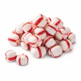 A pile of white and red-striped peppermint candies, showing their distinct cylindrical shape and color pattern.