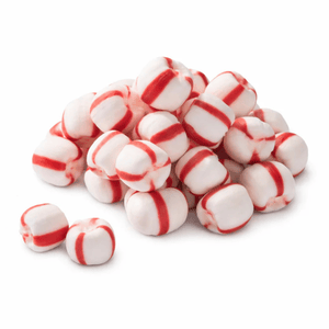 A pile of white and red-striped peppermint candies, showing their distinct cylindrical shape and color pattern.