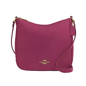 The Coach Outlet Ellie Leather File Bag is a pebbled leather crossbody in a rich magenta color, featuring gold-tone hardware, a zip closure, and an adjustable strap.