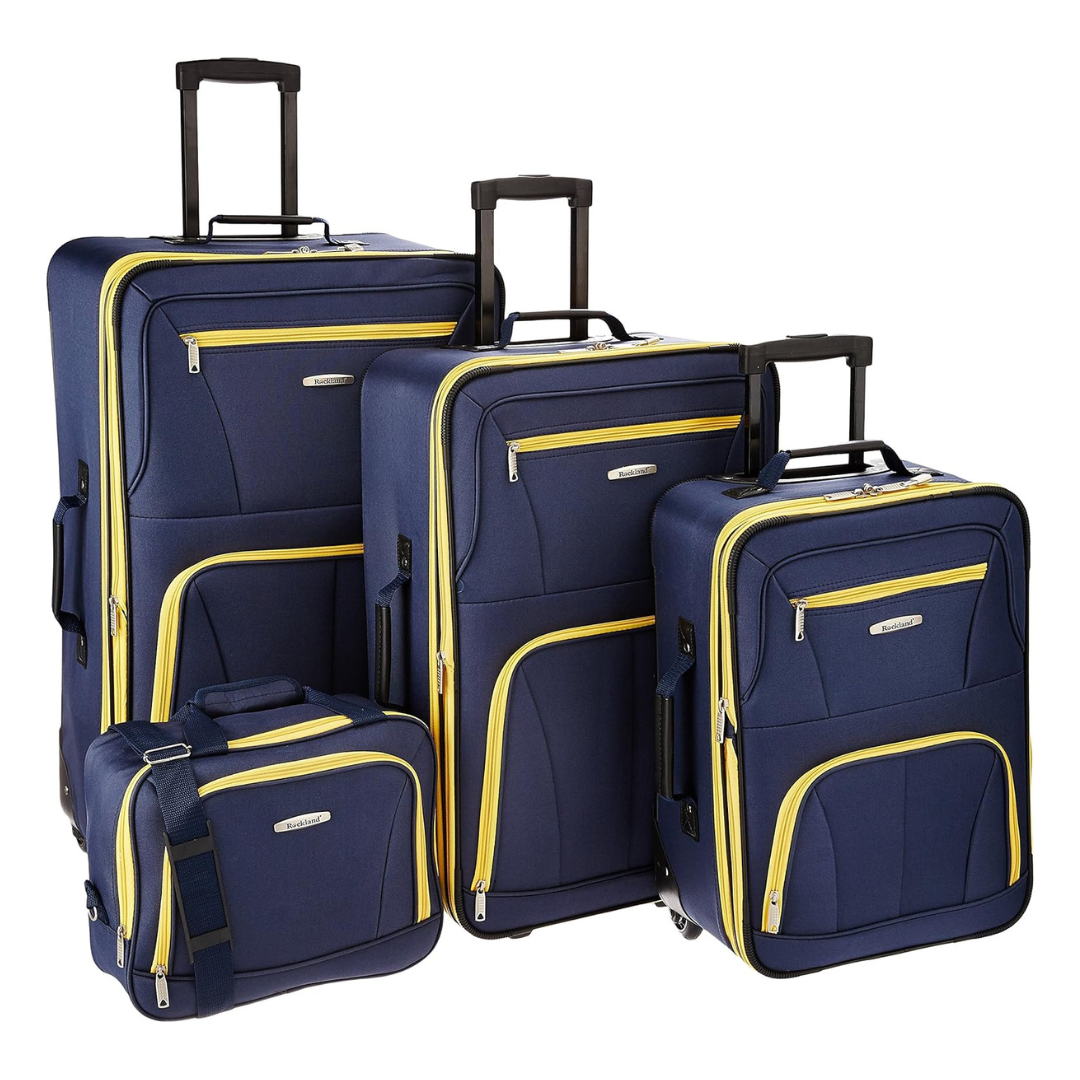 A set of four wheeled luggage pieces in navy with yellow accents, including three upright suitcases and one smaller carry-on bag.