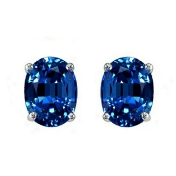Oval-shaped blue gemstone stud earrings set in silver prongs.