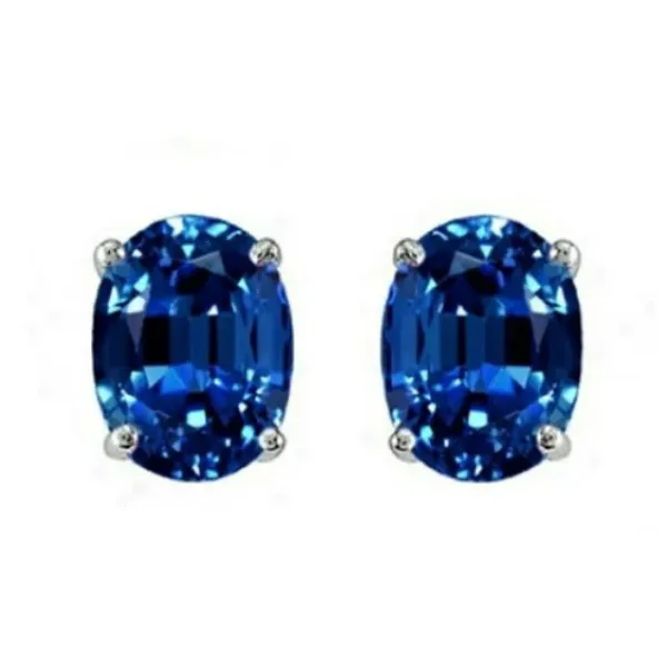Oval-shaped blue gemstone stud earrings set in silver prongs.