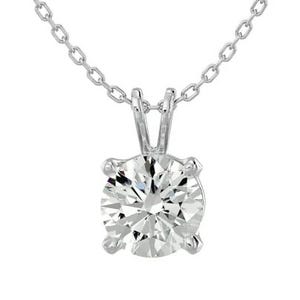 A necklace featuring a 1-carat round-cut moissanite set in a four-prong setting on a silver chain, accompanied by a pair of free matching moissanite stud earrings.