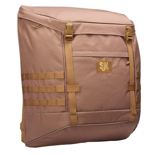 A brown rectangular backpack with tan straps and a front pocket, featuring MOLLE webbing on the sides for additional attachments.
