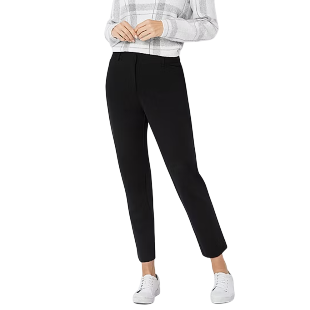 A person is wearing black ankle-length pants with a plaid long-sleeve top and white sneakers.