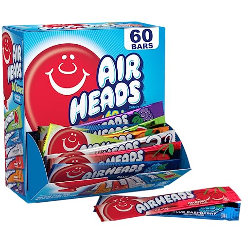 A 60-count box of full-size Airheads candy bars opened to display a variety of flavors. A single Airheads bar in Blue Raspberry flavor lies in front of the box.