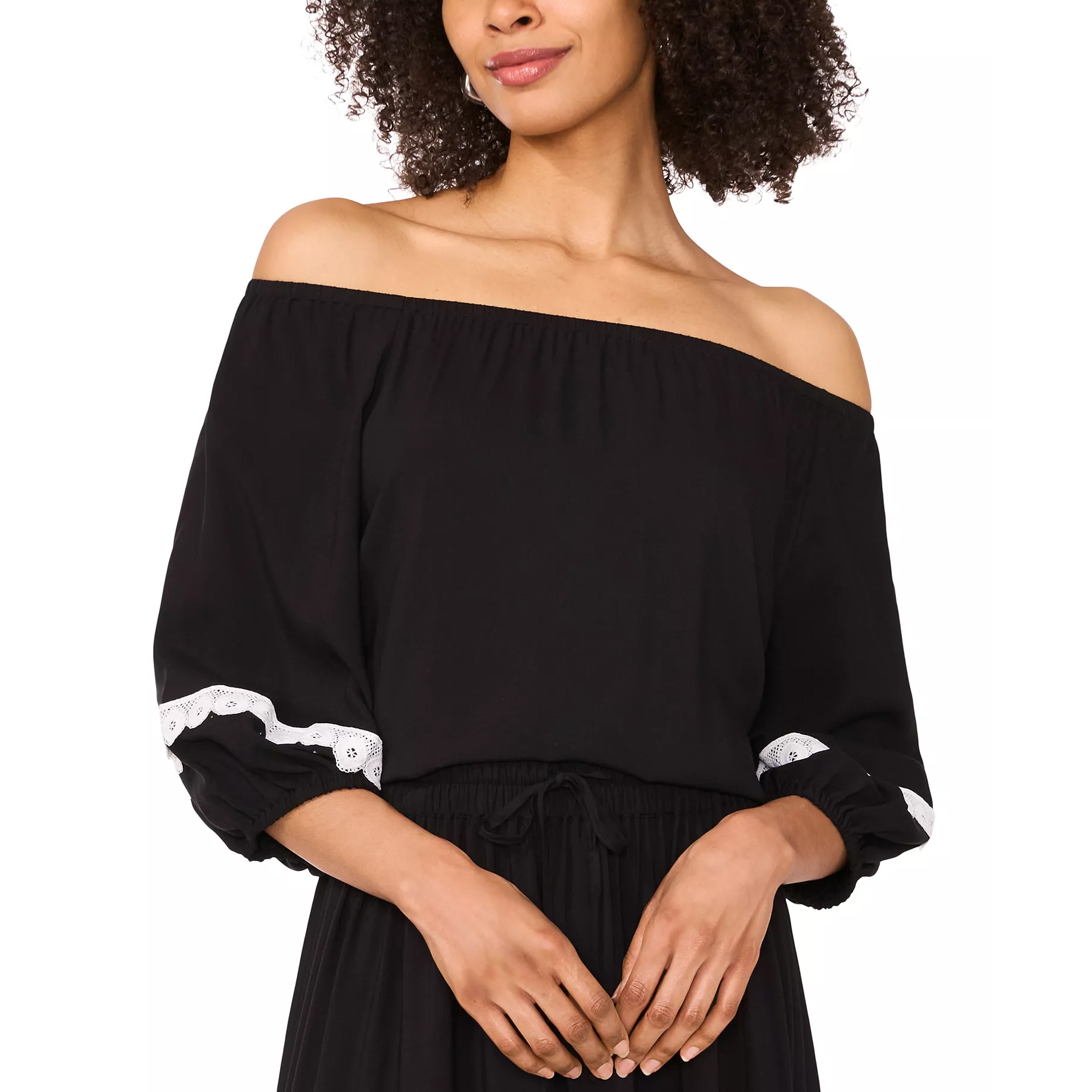 A black off-the-shoulder top with white lace accents on the sleeves, paired with a matching black bottom featuring a drawstring waist.