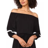A black off-the-shoulder top with white lace accents on the sleeves, paired with a matching black bottom featuring a drawstring waist.