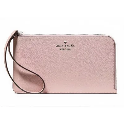 A pink Kate Spade New York wristlet with a textured leather finish, featuring a zippered closure and a strap for easy carrying.