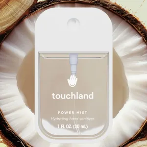 Touchland Power Mist hydrating hand sanitizer, 1 FL OZ (30 mL), set against a coconut-themed background.