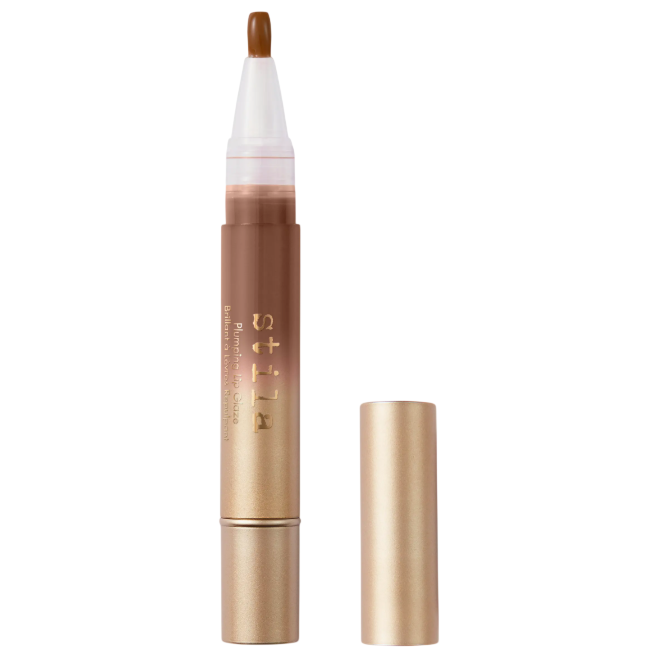 Stila Plumping Lip Glaze with a transparent applicator tip and a gold cap, featuring a sleek gold tube design.