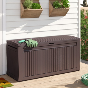 A large brown outdoor storage bench on a porch with two wooden planters on the wall above it.