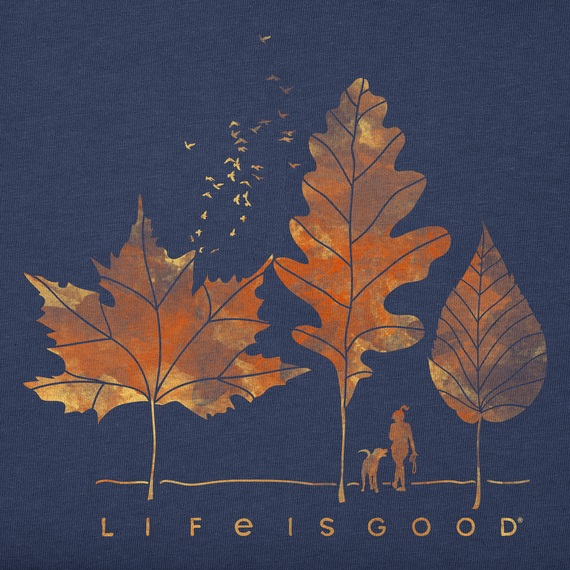 A navy blue T-shirt with a design of three autumn leaves, birds flying away, and a silhouette of a person with a dog, captioned \“Life is good.\“