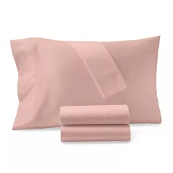 A set of pink bed linens, featuring a folded sheet and pillowcase, with additional sheets rolled in front.