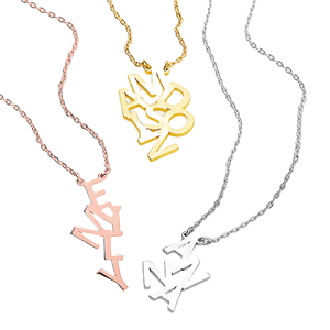 Three necklaces featuring vertical letter arrangements in different metal tones: rose gold, gold, and silver.