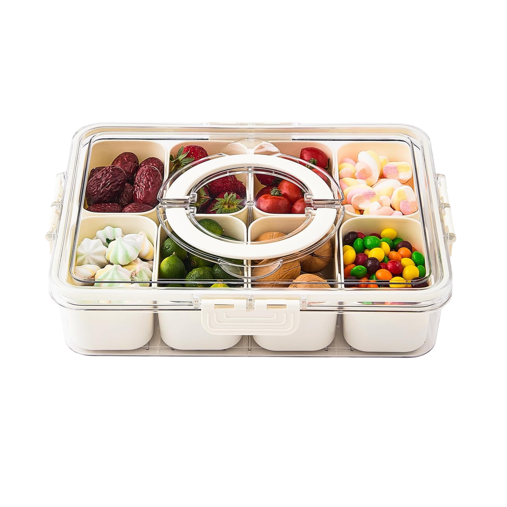A compartmentalized storage container holds various snacks, including dates, strawberries, small limes, nuts, heart-shaped marshmallows, rainbow meringue cookies, and colorful candies.