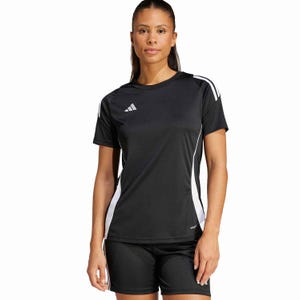A model wears a black athletic outfit featuring an Adidas short-sleeve jersey with white accents and matching shorts.