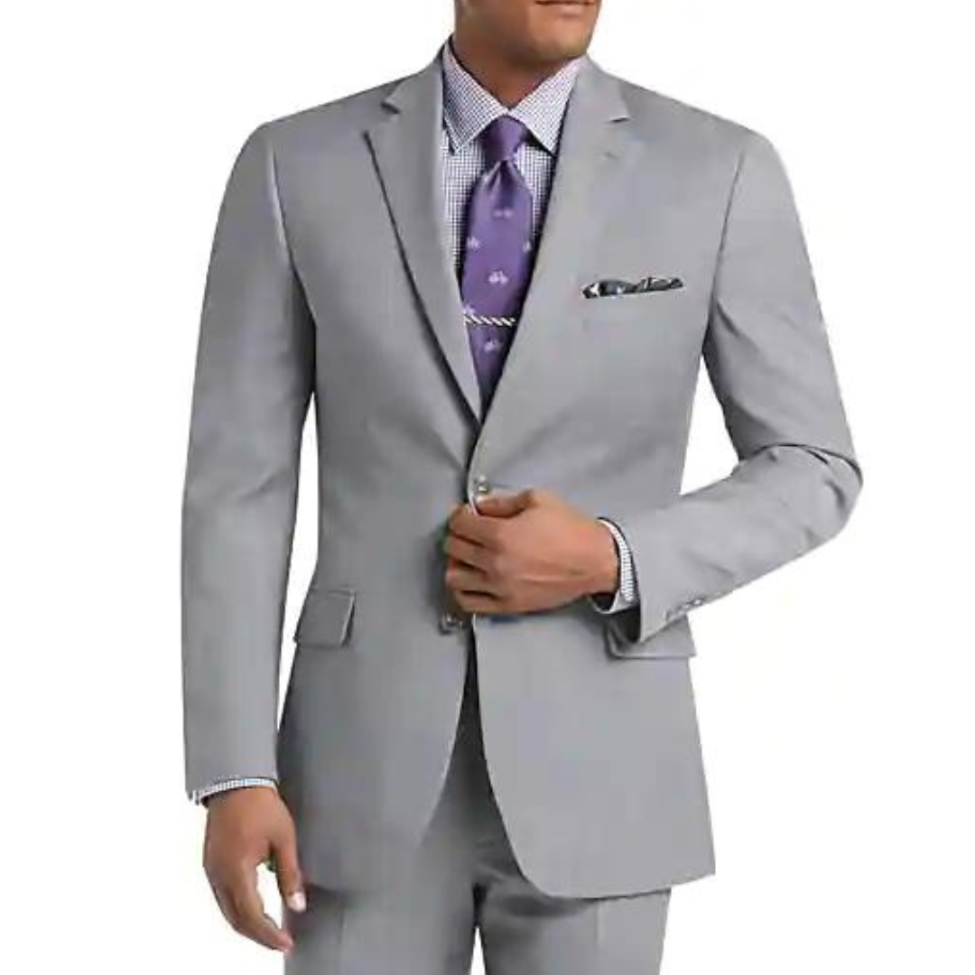 A man wearing a light gray suit with a patterned purple tie and pocket square.
