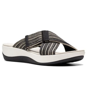 A sandal featuring a black and beige striped crisscross strap on a white platform sole with a wedge heel and black base.