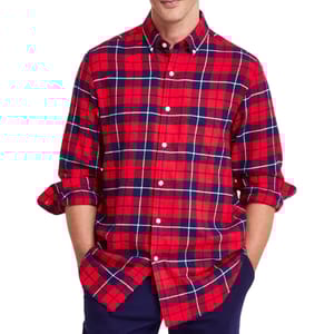 A red and navy plaid flannel shirt with a button-down collar and rolled-up sleeves.