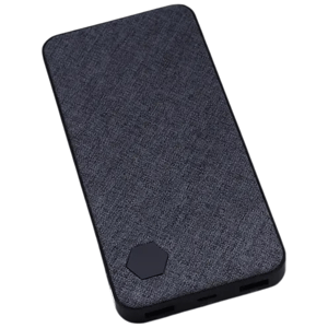 A portable power bank with a fabric-textured surface and multiple USB ports, featuring a small hexagonal design accent.