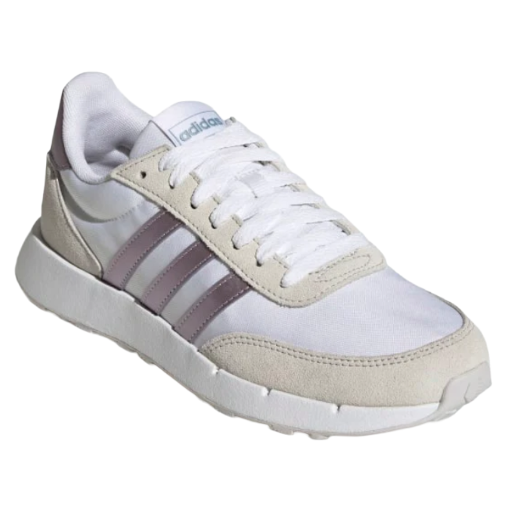 Adidas sneaker with a white upper, beige suede overlays, and purple stripes, featuring a white sole and lace-up design.