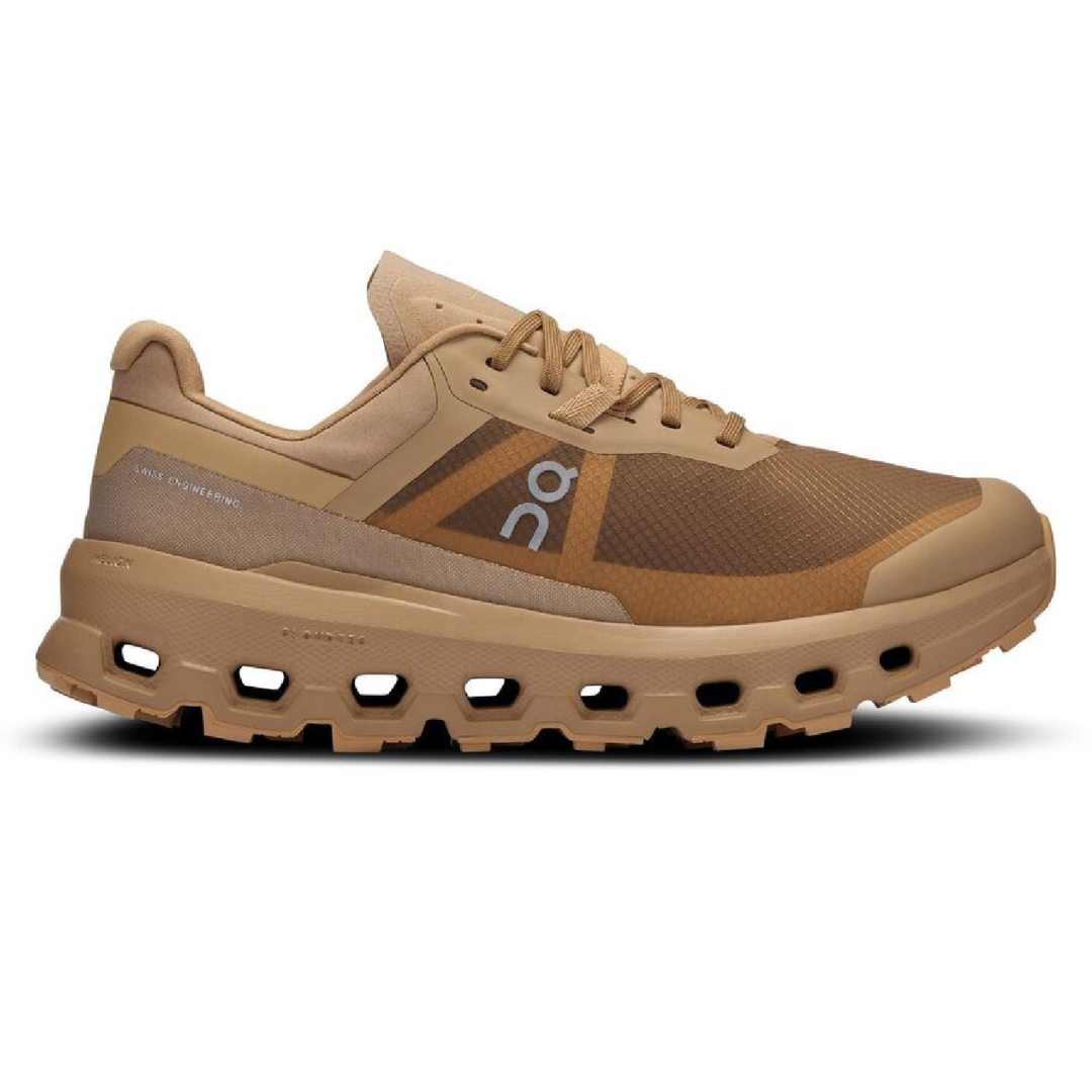 The On Cloudvista 2 shoes feature a beige and brown color scheme with a breathable mesh upper and distinctive CloudTec outsole for cushioning. Swiss engineering branding is visible on the side.