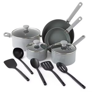 A 10-piece non-stick cookware set in gray, featuring two frying pans, two saucepans with lids, a Dutch oven with lid, and four black utensils: a spatula, a spoon, a slotted spatula, and a slotted spoon.