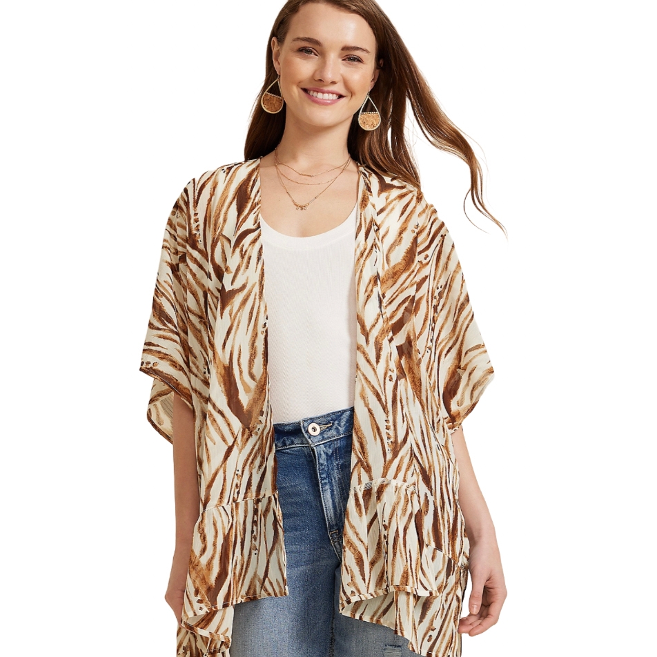 A short-sleeve, lightweight kimono wrap with a brown and cream zigzag pattern over a white top and blue jeans.